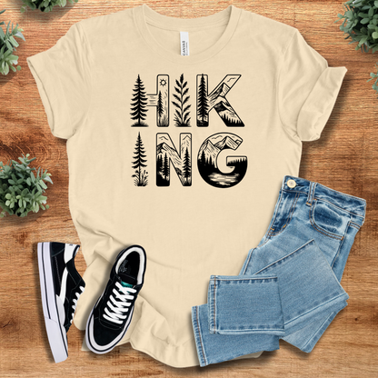 Heather-mauve t-shirt with '' text, flat lay styled on a wooden surface.