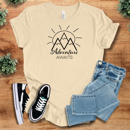 Heather-mauve t-shirt with '' text, flat lay styled on a wooden surface.