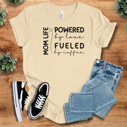 Heather-aqua t-shirt with '' text, flat lay styled on a wooden surface.