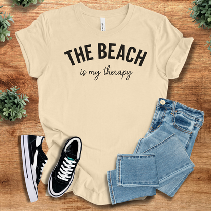 Athletic-heather t-shirt with '' text, flat lay styled on a wooden surface.