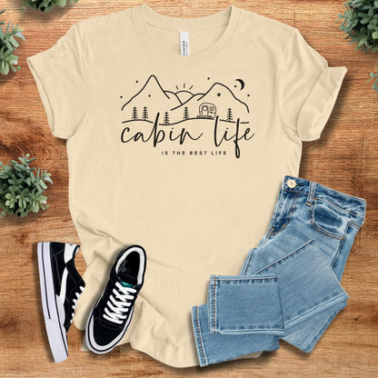 Military-green t-shirt with '' text, flat lay styled on a wooden surface.