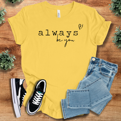 Athletic-heather t-shirt with '' text, flat lay styled on a wooden surface.
