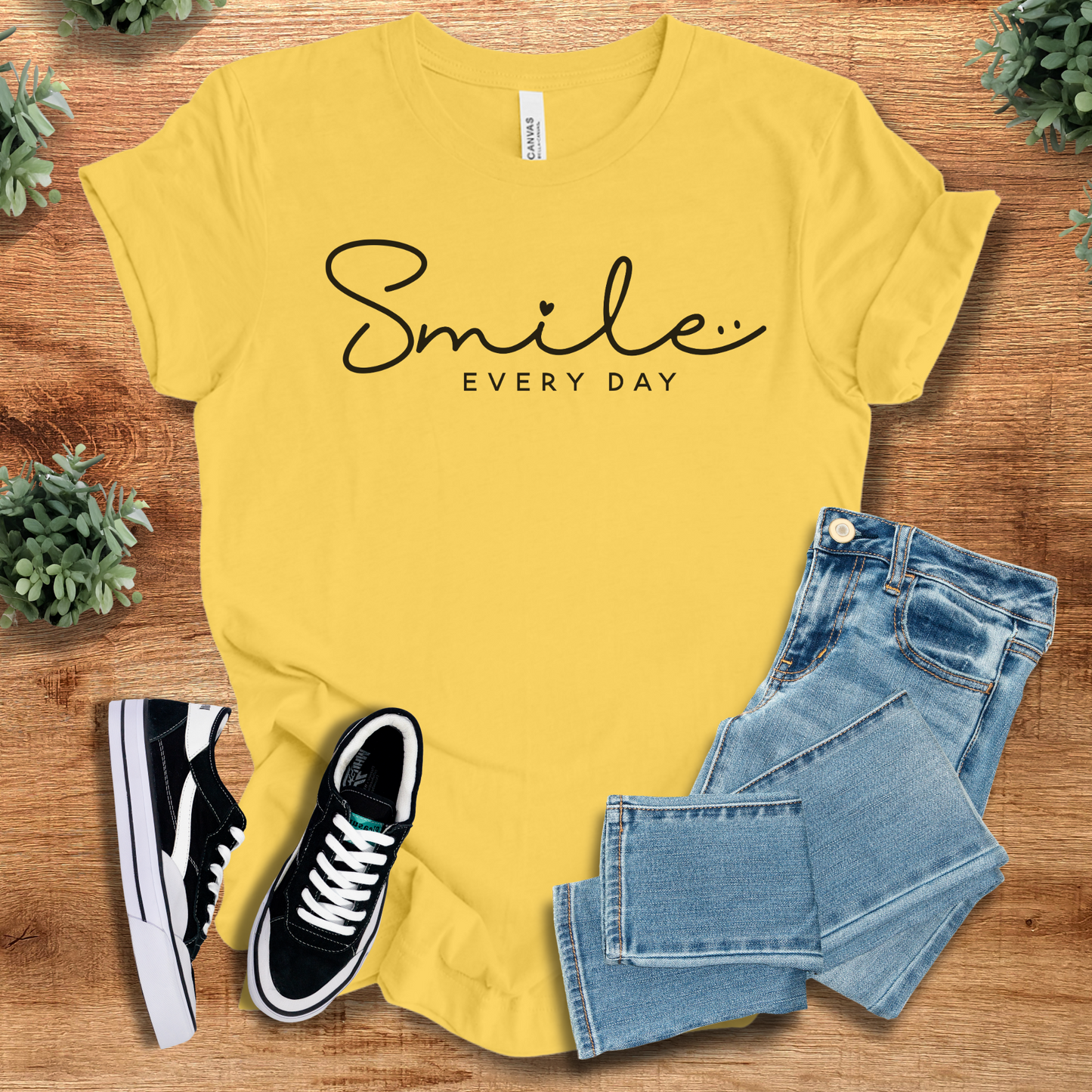Yellow Smile Every Day T‑Shirt on Bella+Canvas 3001, styled with jeans and sneakers. Bright soft unisex tee with cheerful minimalist design.