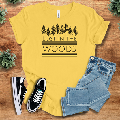 Military-green t-shirt with '' text, flat lay styled on a wooden surface.