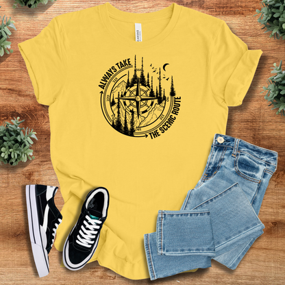 Military-green t-shirt with '' text, flat lay styled on a wooden surface.