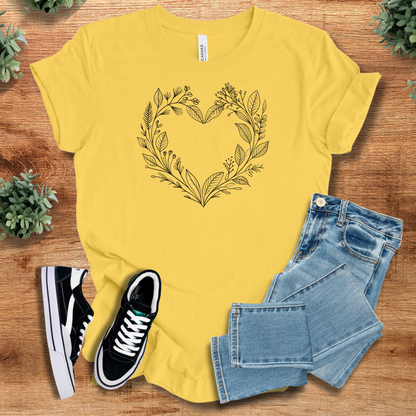 Athletic-heather t-shirt with '' text, flat lay styled on a wooden surface.