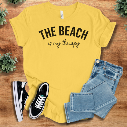 Athletic-heather t-shirt with '' text, flat lay styled on a wooden surface.