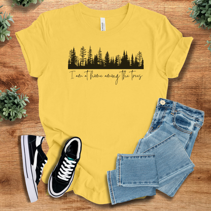Heather-mauve t-shirt with '' text, flat lay styled on a wooden surface.