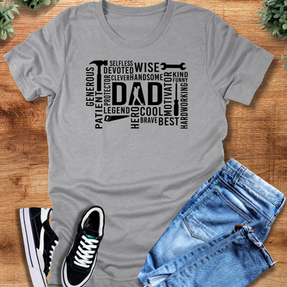 Black t-shirt with '' text, flat lay styled on a wooden surface.