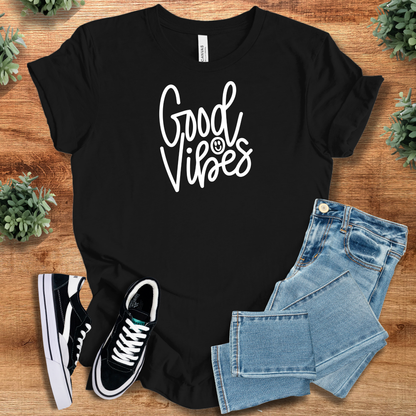 Athletic-heather t-shirt with '' text, flat lay styled on a wooden surface.