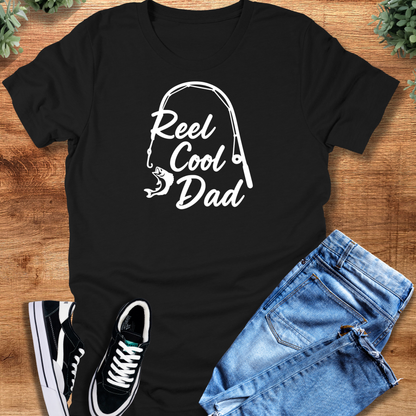 Military-green t-shirt with '' text, flat lay styled on a wooden surface.