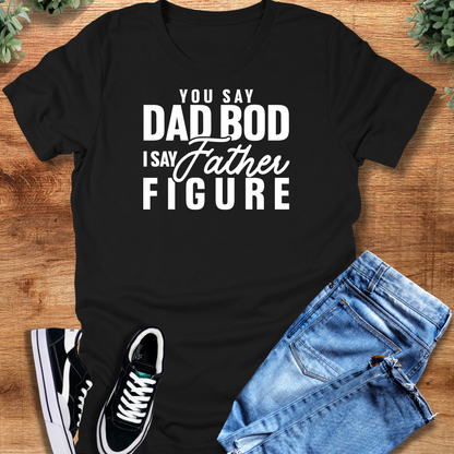 Black t-shirt with '' text, flat lay styled on a wooden surface.