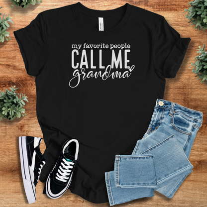 Athletic-heather t-shirt with '' text, flat lay styled on a wooden surface.