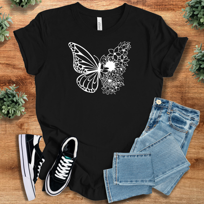 Military-green t-shirt with '' text, flat lay styled on a wooden surface.