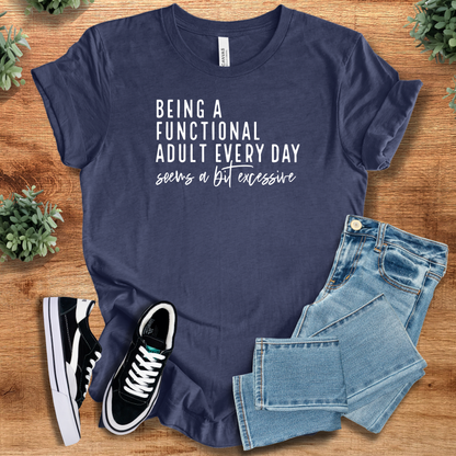 Heather-navy t-shirt with '' text, flat lay styled on a wooden surface.