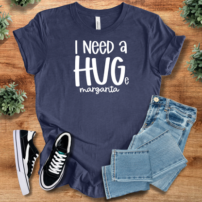 Heather-mauve t-shirt with '' text, flat lay styled on a wooden surface.