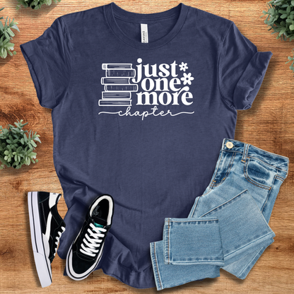 Heather-aqua t-shirt with '' text, flat lay styled on a wooden surface.
