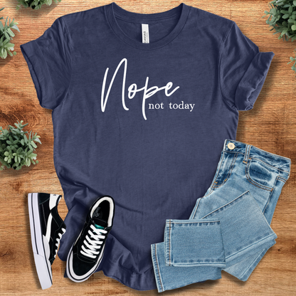 Heather-aqua t-shirt with '' text, flat lay styled on a wooden surface.