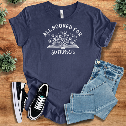 Heather Navy t-shirt with '' text, flat lay styled on a wooden surface.