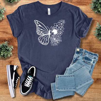 Military-green t-shirt with '' text, flat lay styled on a wooden surface.