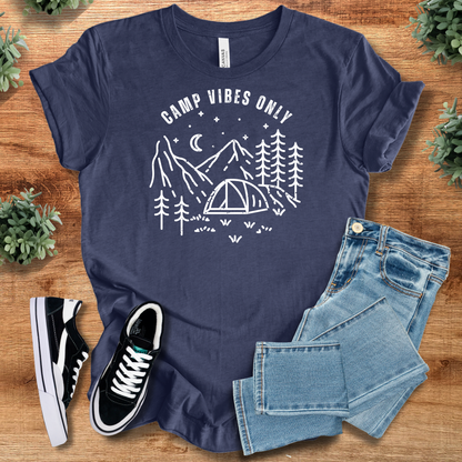 Heather-mauve t-shirt with '' text, flat lay styled on a wooden surface.