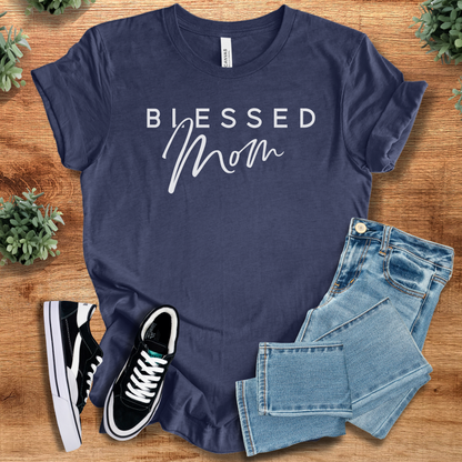 Heather-aqua t-shirt with '' text, flat lay styled on a wooden surface.