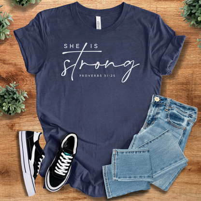Heather-navy t-shirt with '' text, flat lay styled on a wooden surface.