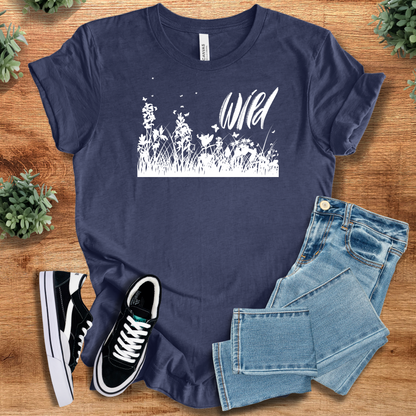 Heather-mauve t-shirt with '' text, flat lay styled on a wooden surface.