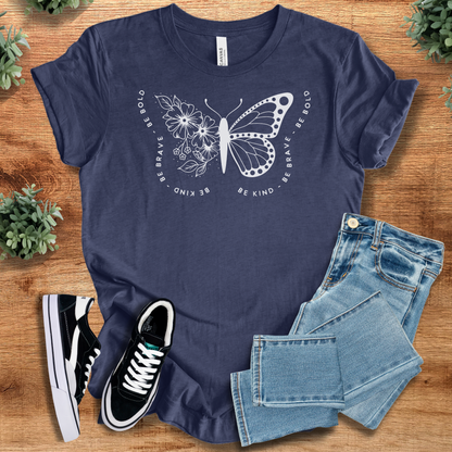 Soft-cream t-shirt with '' text, flat lay styled on a wooden surface.