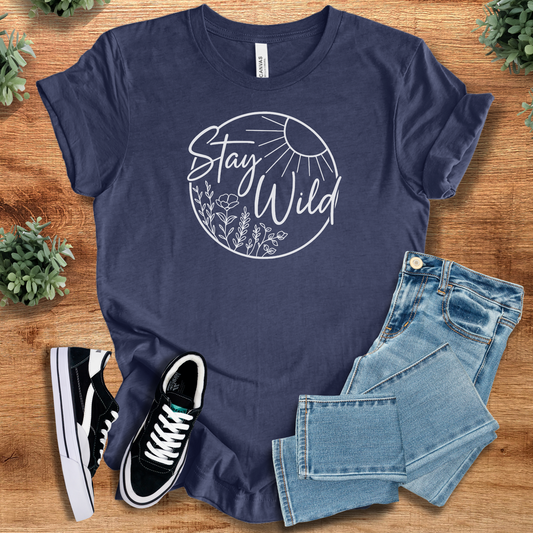 Stay Wild Nature Tee T‑Shirt in navy blue on soft Bella+Canvas 3001 fabric, styled with jeans and sneakers. Minimalist graphic tee for everyday wear.