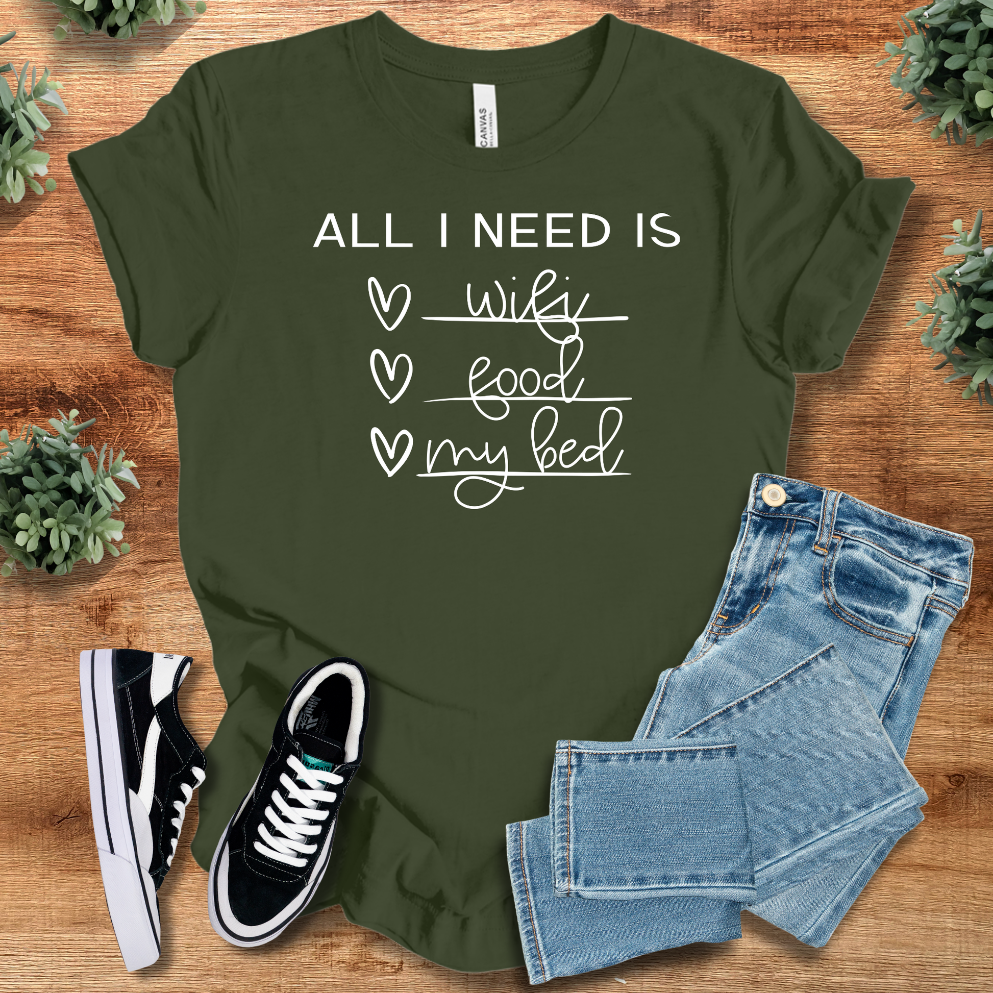 Soft-cream t-shirt with '' text, flat lay styled on a wooden surface.