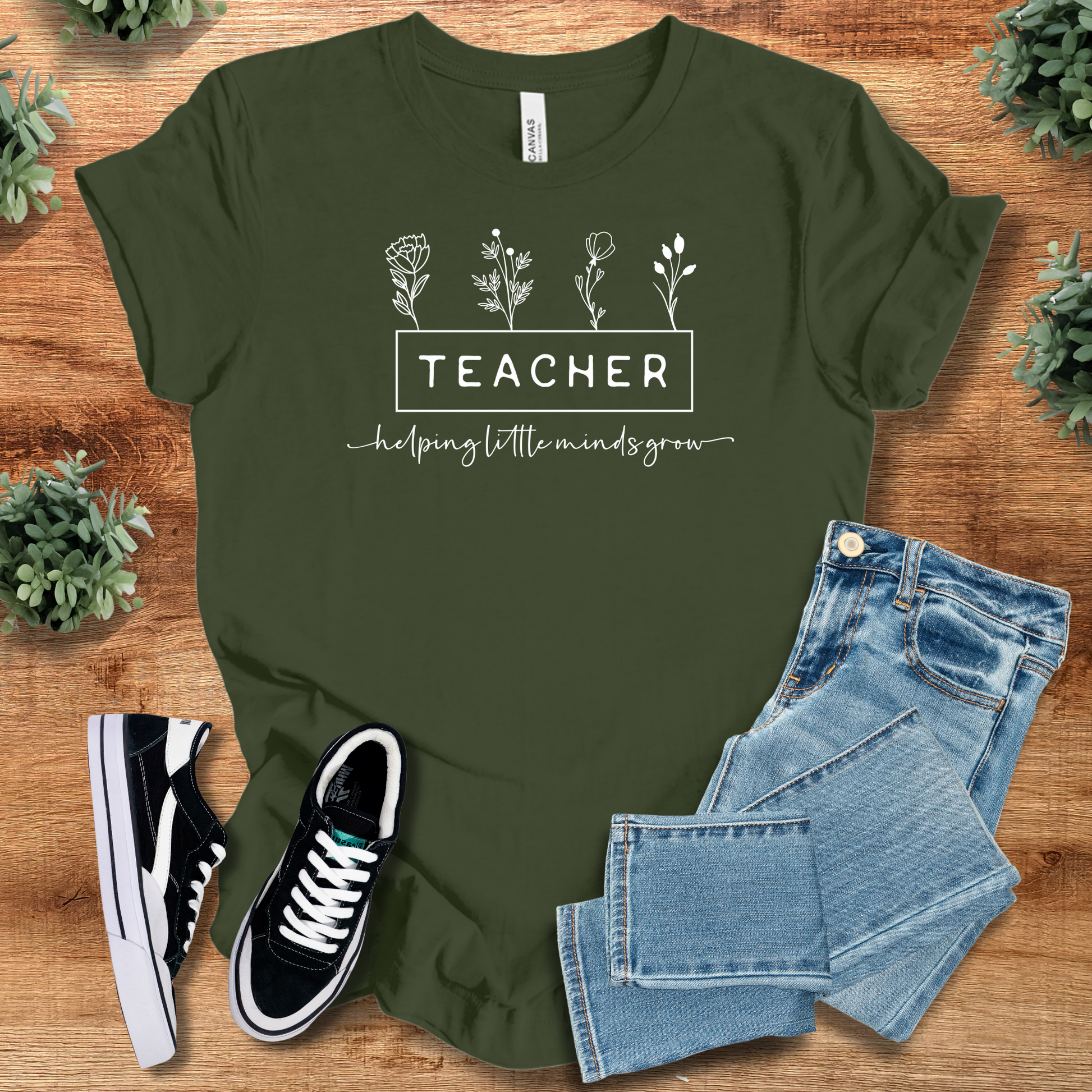 Soft-cream t-shirt with '' text, flat lay styled on a wooden surface.