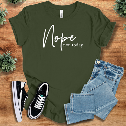 Heather-aqua t-shirt with '' text, flat lay styled on a wooden surface.