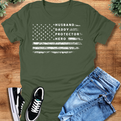 Heather-navy t-shirt with '' text, flat lay styled on a wooden surface.