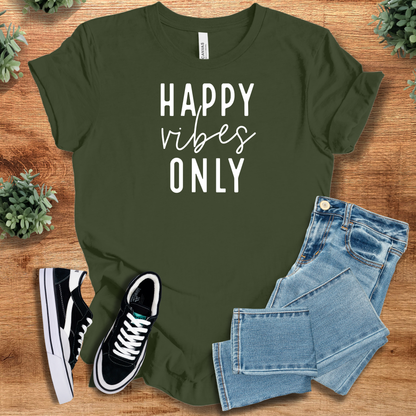 Heather-mauve t-shirt with '' text, flat lay styled on a wooden surface.
