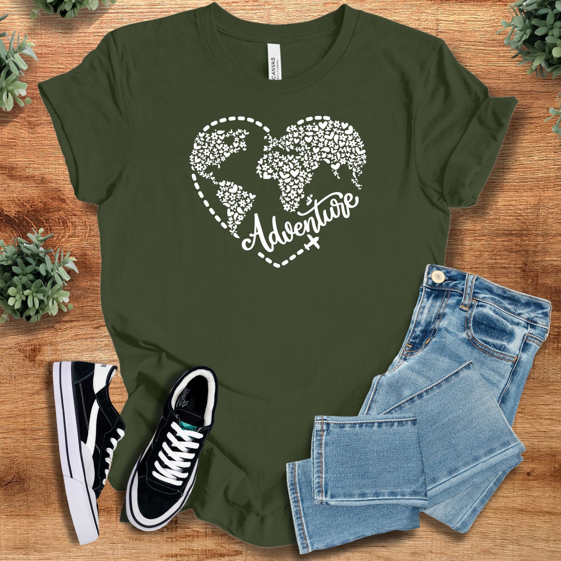 Heather-mauve t-shirt with '' text, flat lay styled on a wooden surface.