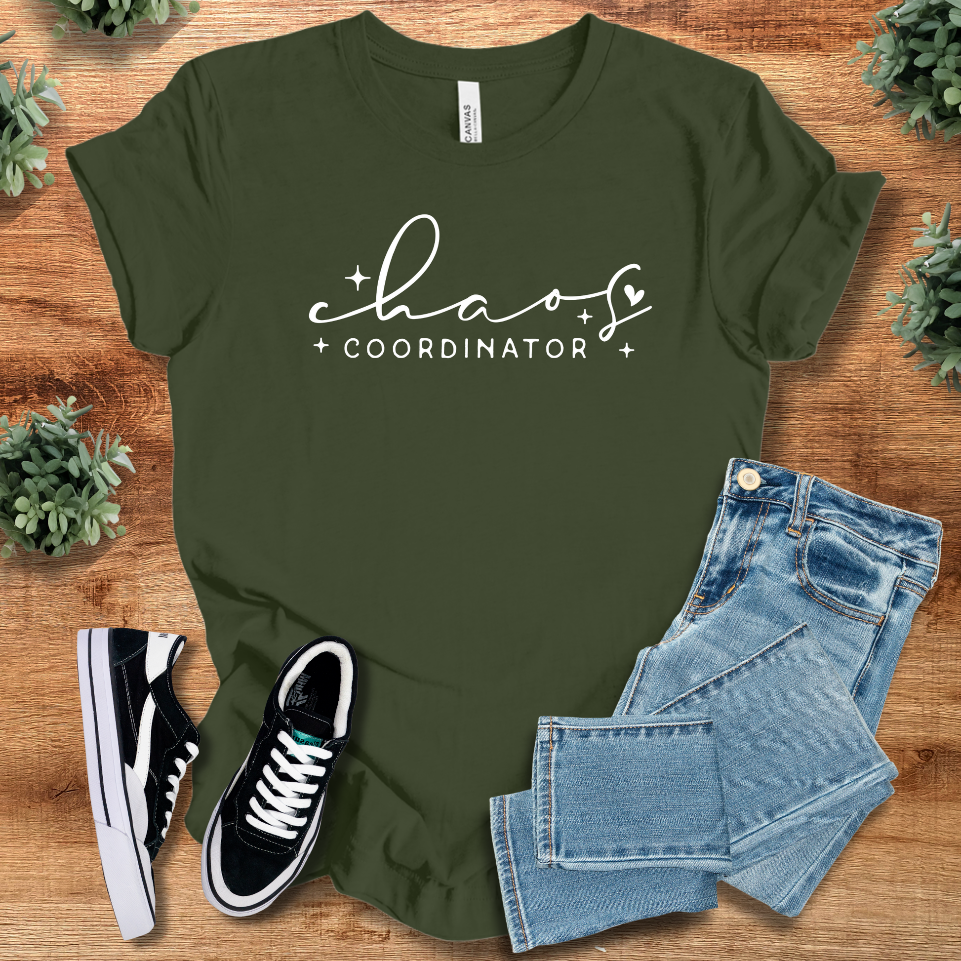 Soft-cream t-shirt with '' text, flat lay styled on a wooden surface.