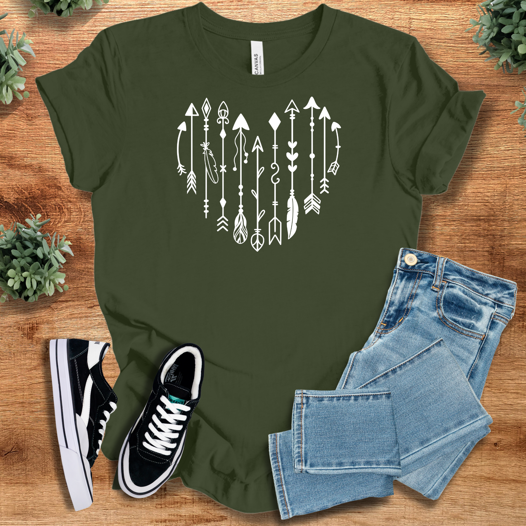 Heather-mauve t-shirt with '' text, flat lay styled on a wooden surface.