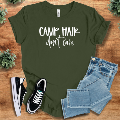 Heather-aqua t-shirt with '' text, flat lay styled on a wooden surface.