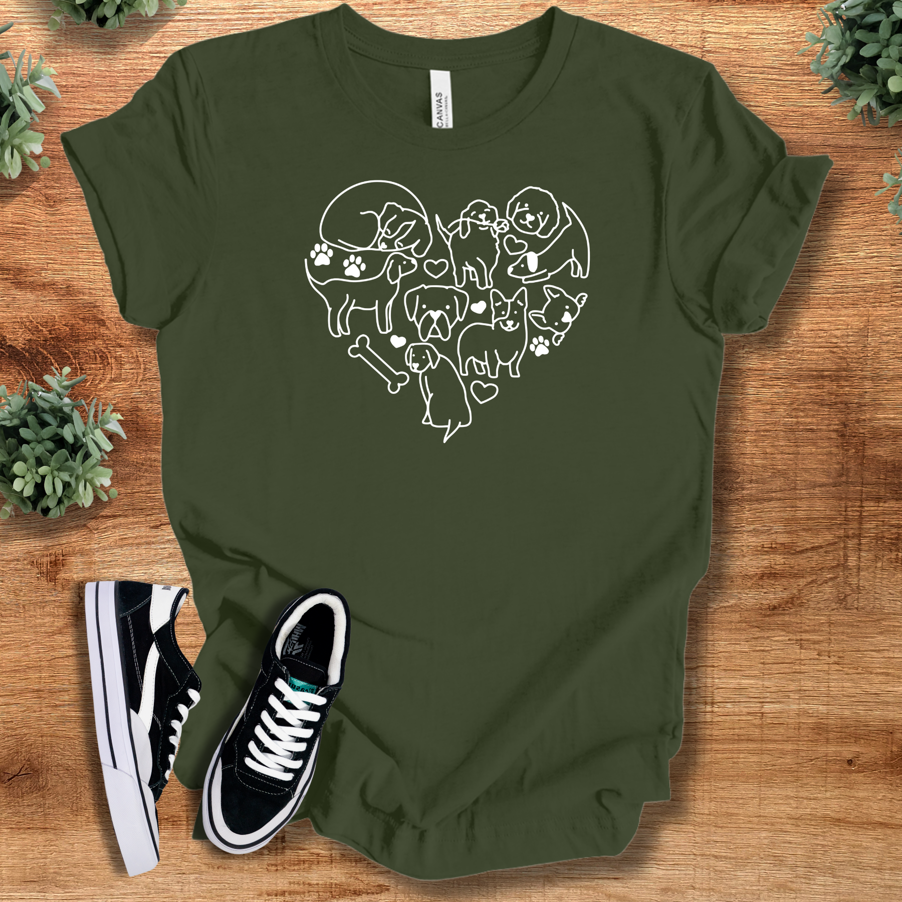 Heather-navy t-shirt with '' text, flat lay styled on a wooden surface.