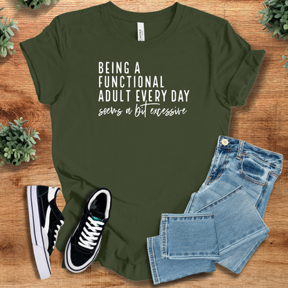 Heather-navy t-shirt with '' text, flat lay styled on a wooden surface.