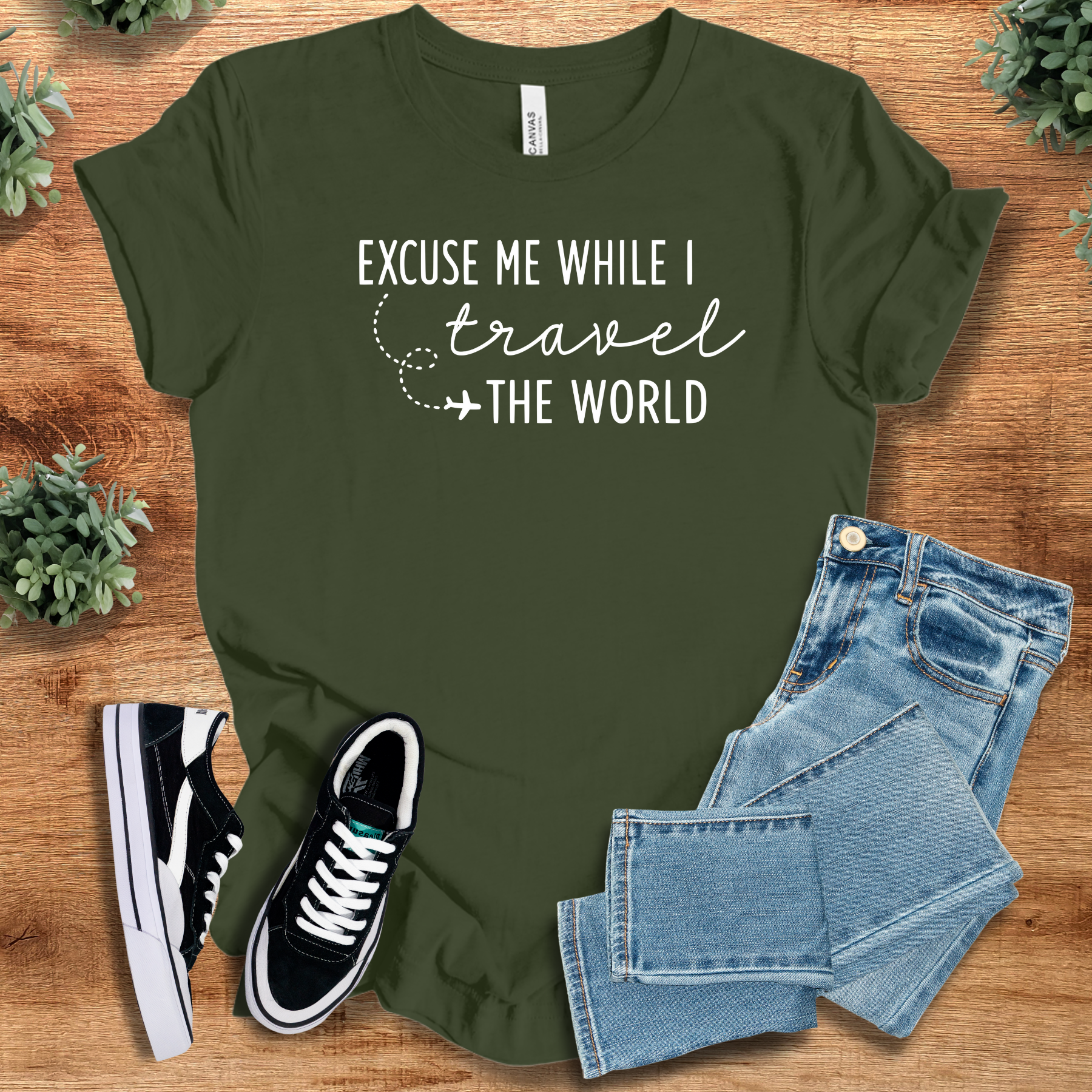 Heather-aqua t-shirt with '' text, flat lay styled on a wooden surface.