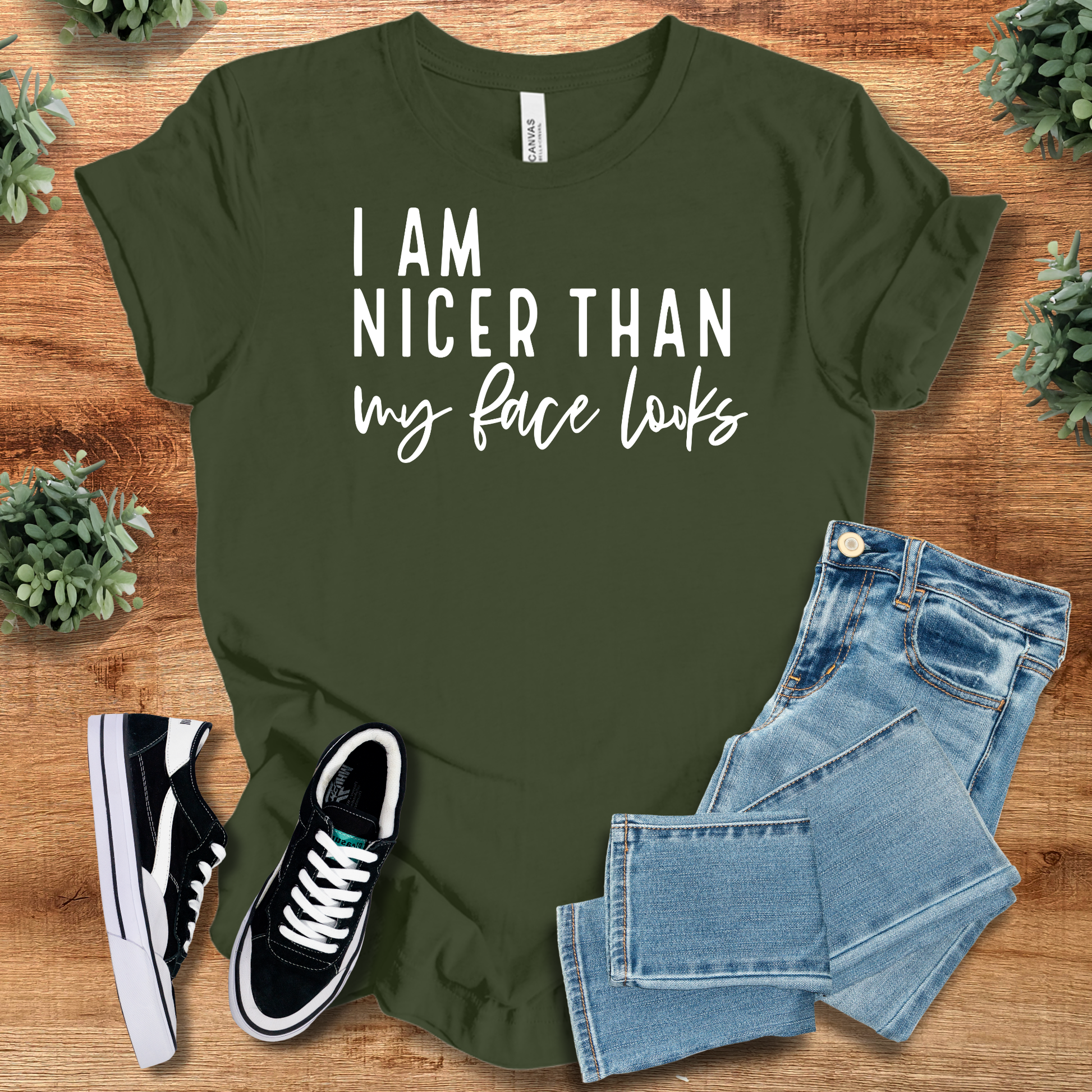 Heather-mauve t-shirt with '' text, flat lay styled on a wooden surface.