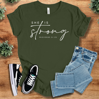 Heather-navy t-shirt with '' text, flat lay styled on a wooden surface.