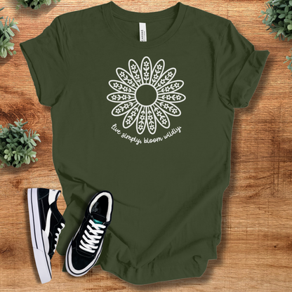 Heather-mauve t-shirt with '' text, flat lay styled on a wooden surface.