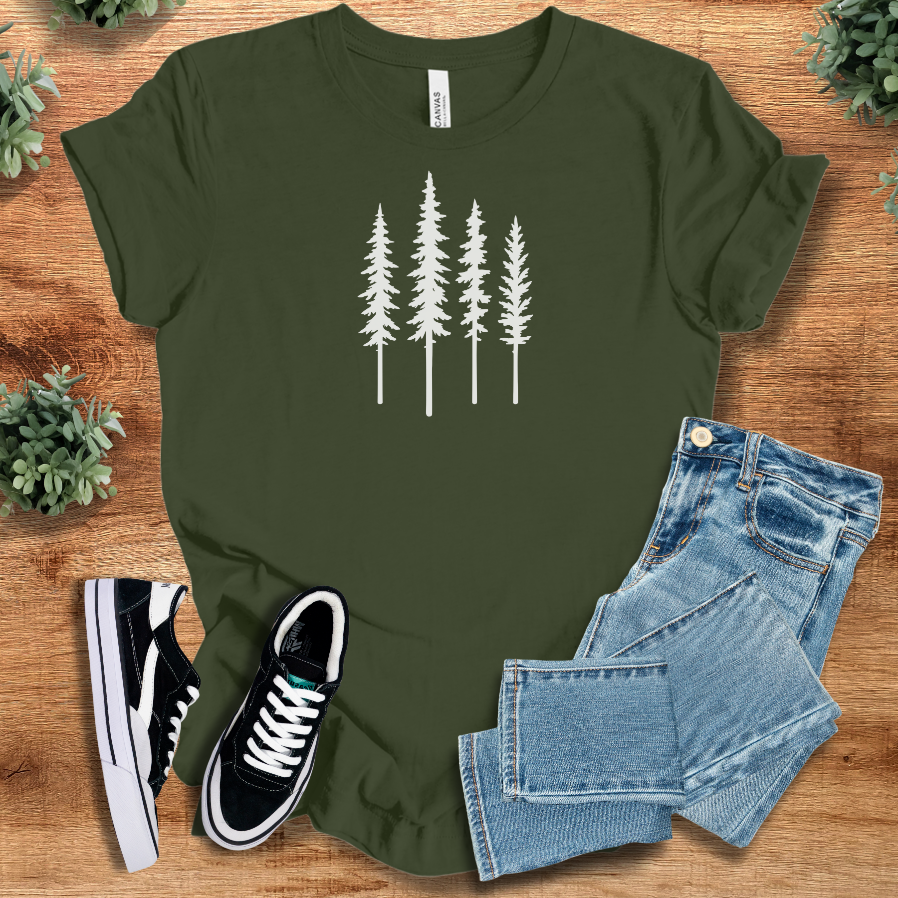 Heather-mauve t-shirt with '' text, flat lay styled on a wooden surface.
