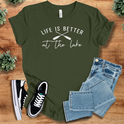 Heather-navy t-shirt with '' text, flat lay styled on a wooden surface.