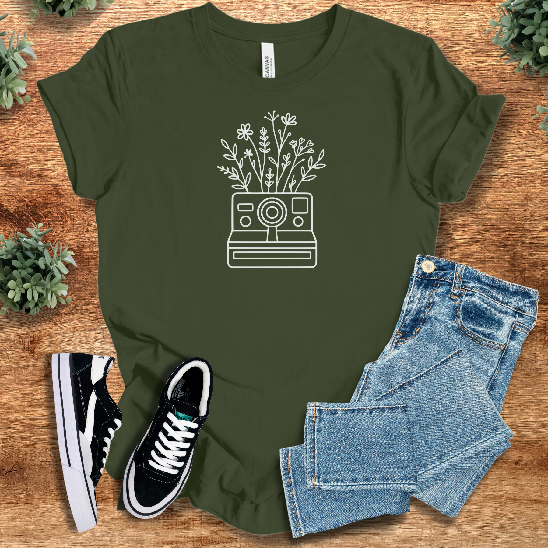 Heather-mauve t-shirt with '' text, flat lay styled on a wooden surface.