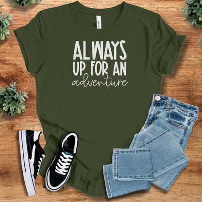Heather-mauve t-shirt with '' text, flat lay styled on a wooden surface.