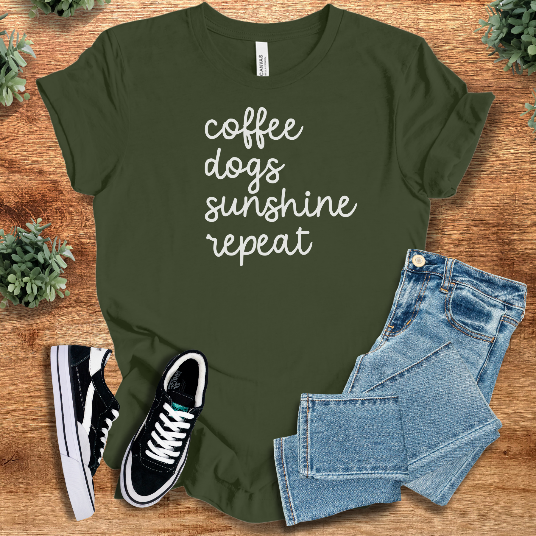 Heather-aqua t-shirt with '' text, flat lay styled on a wooden surface.